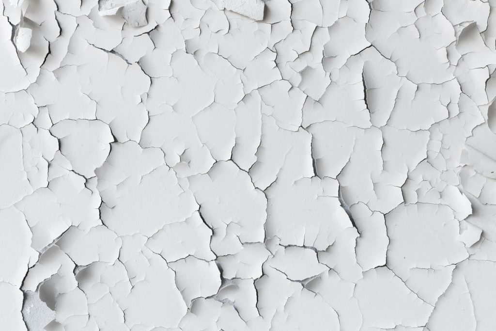Cracked lead paint surface that can create airborne lead dust during renovation