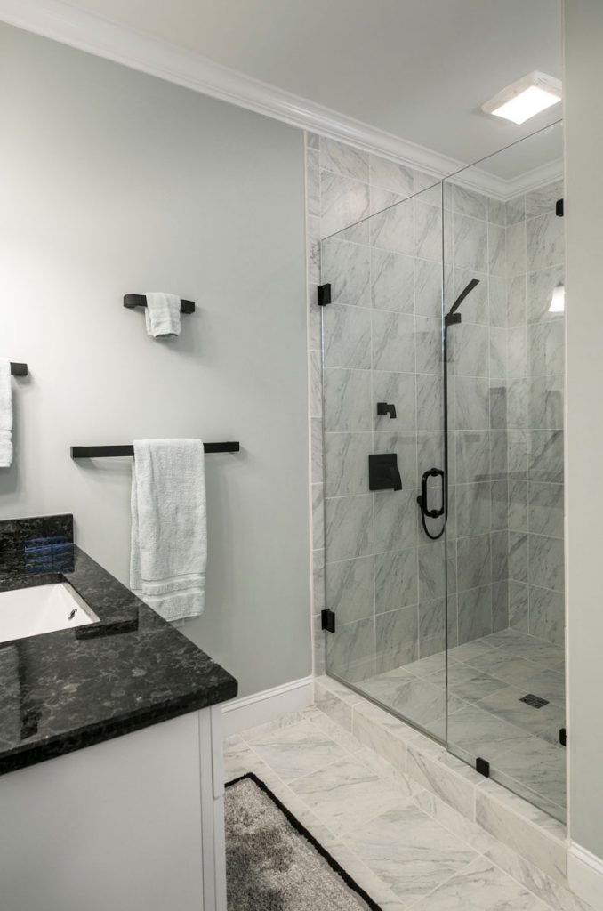 Spotless modern bathroom with glass shower after a professional deep cleaning service