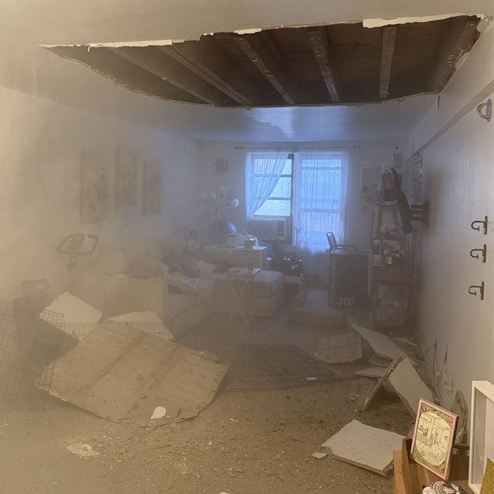 Airborne dust contamination throughout apartment following residential ceiling collapse